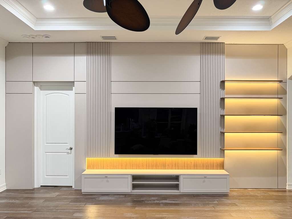 White frameless cabinetry in a modern living room